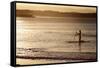 A Woman on a Stand-Up Paddleboard Heads Towards Main Beach, Noosa, at Sunset-William Gray-Framed Stretched Canvas