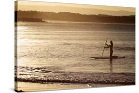 A Woman on a Stand-Up Paddleboard Heads Towards Main Beach, Noosa, at Sunset-William Gray-Stretched Canvas