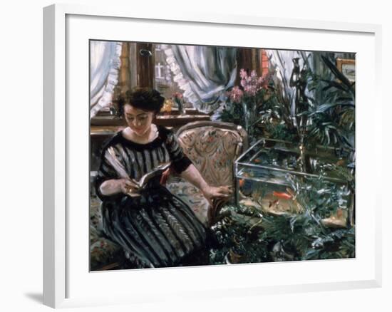 A Woman Reading Near a Goldfish Tank-Lovis Corinth-Framed Giclee Print