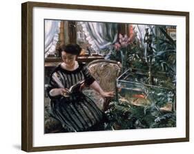 A Woman Reading Near a Goldfish Tank-Lovis Corinth-Framed Giclee Print