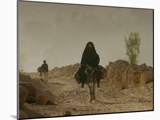 A Woman Rides a Donkey in Bamiyan Province, Central Afghanistan, September 16, 2005-Tomas Munita-Mounted Photographic Print