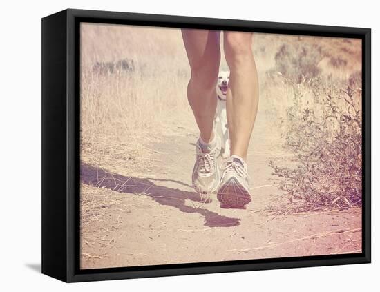 A Woman Running on a Trail with a Dog-graphicphoto-Framed Stretched Canvas