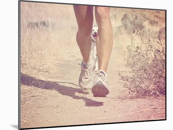 A Woman Running on a Trail with a Dog-graphicphoto-Mounted Photographic Print