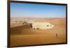 A Woman Runs Down from the Summit of Sossusvlei Sand Dune, Namibia, Africa-Alex Treadway-Framed Photographic Print