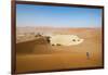 A Woman Runs Down from the Summit of Sossusvlei Sand Dune, Namibia, Africa-Alex Treadway-Framed Photographic Print
