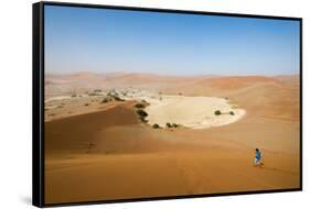 A Woman Runs Down from the Summit of Sossusvlei Sand Dune, Namibia, Africa-Alex Treadway-Framed Stretched Canvas