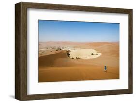 A Woman Runs Down from the Summit of Sossusvlei Sand Dune, Namibia, Africa-Alex Treadway-Framed Photographic Print