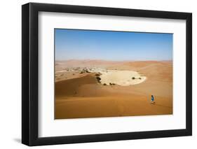 A Woman Runs Down from the Summit of Sossusvlei Sand Dune, Namibia, Africa-Alex Treadway-Framed Photographic Print