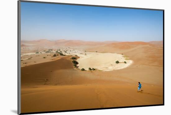 A Woman Runs Down from the Summit of Sossusvlei Sand Dune, Namibia, Africa-Alex Treadway-Mounted Photographic Print