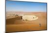 A Woman Runs Down from the Summit of Sossusvlei Sand Dune, Namibia, Africa-Alex Treadway-Mounted Photographic Print