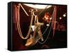 A Woman's High Heeled Shoe Hangs with Some Mardi Gras Beads-null-Framed Stretched Canvas