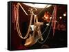 A Woman's High Heeled Shoe Hangs with Some Mardi Gras Beads-null-Framed Stretched Canvas