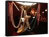 A Woman's High Heeled Shoe Hangs with Some Mardi Gras Beads-null-Framed Stretched Canvas