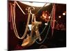 A Woman's High Heeled Shoe Hangs with Some Mardi Gras Beads-null-Mounted Premium Photographic Print
