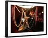 A Woman's High Heeled Shoe Hangs with Some Mardi Gras Beads-null-Framed Photographic Print