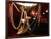 A Woman's High Heeled Shoe Hangs with Some Mardi Gras Beads-null-Framed Photographic Print
