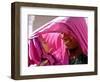 A Woman Shields Her Child from the Sun Using Her Scarf-null-Framed Photographic Print