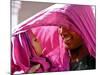 A Woman Shields Her Child from the Sun Using Her Scarf-null-Mounted Photographic Print