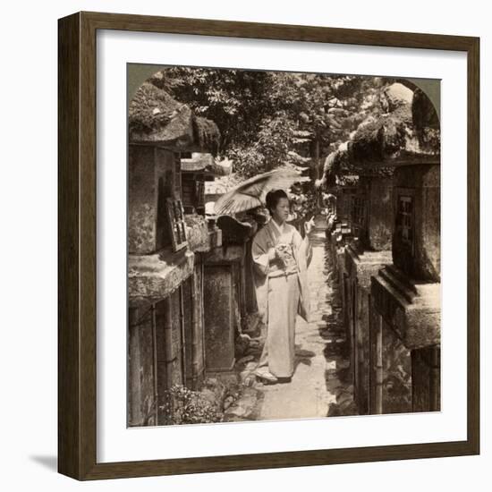 A Woman Shinto Devotee Counting the Stone Lanterns, Kasuga Shrine, Nara, Japan, 1904-Underwood & Underwood-Framed Photographic Print