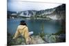 A Woman Sits at Dusk Near Mirror Lake in the Wallowa Mountains in Northeast Oregon-Ben Herndon-Mounted Photographic Print