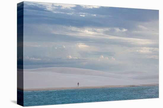 A Woman Walks across the Dunes in Brazil's Lencois Maranhenses National Park-Alex Saberi-Stretched Canvas