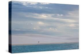 A Woman Walks across the Dunes in Brazil's Lencois Maranhenses National Park-Alex Saberi-Stretched Canvas