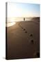 A Woman Walks Down A Secluded Beach On Sicily's Southern Coast-Erik Kruthoff-Stretched Canvas