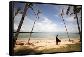 A Woman Walks with Her Shoes Off on the Beach Near the Exclusive Balesin Island Club, Philippines-Carlo Acenas-Framed Stretched Canvas