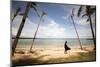 A Woman Walks with Her Shoes Off on the Beach Near the Exclusive Balesin Island Club, Philippines-Carlo Acenas-Mounted Photographic Print
