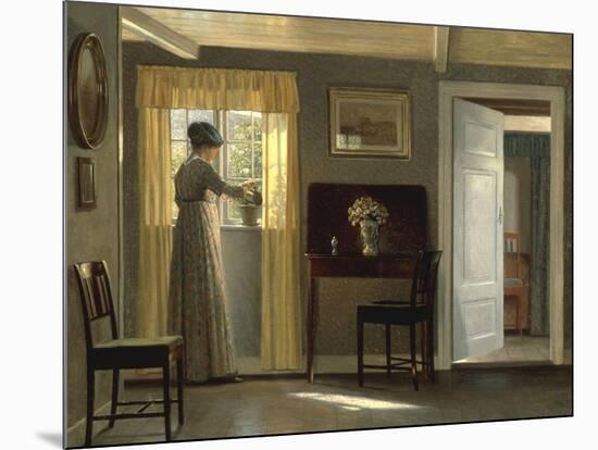 A Woman watering a Plant by a Window, 1915-Alfred Broge-Mounted Giclee Print