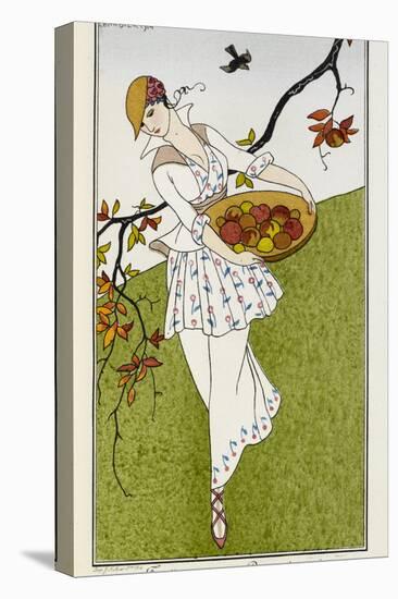 A woman wearing a silk printed outfit, and straw hat She is carrying a bowl of fruit-Georges Barbier-Stretched Canvas