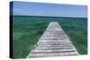 A Wood Dock in the Foreground with Clear Green Water and Blue Skies Near the Isle of Youth, Cuba-James White-Stretched Canvas