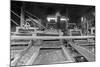 A Worker Stands over a Rock or Gravel Processing Facility, Ca. 1910-null-Mounted Photographic Print