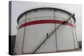 A Worker Walks Down Stairs of an Oil Tank at a Refinery in Wuhan, Hubei Province-Darley Shen-Stretched Canvas