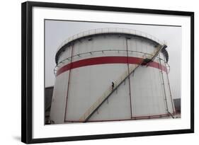 A Worker Walks Down Stairs of an Oil Tank at a Refinery in Wuhan, Hubei Province-Darley Shen-Framed Photographic Print