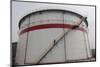 A Worker Walks Down Stairs of an Oil Tank at a Refinery in Wuhan, Hubei Province-Darley Shen-Mounted Photographic Print