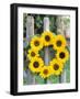 A Wreath of Sunflowers Hanging on a Fence-Alena Hrbkova-Framed Photographic Print