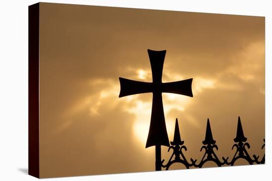 A wrought-iron cross on a fence in Syria at sunrise.-Emily Wilson-Stretched Canvas