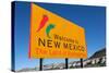 A Yellow Welcome to New Mexico Sign in Front of a Blue Sky-flippo-Stretched Canvas