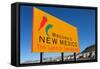A Yellow Welcome to New Mexico Sign in Front of a Blue Sky-flippo-Framed Stretched Canvas