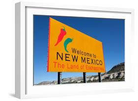 A Yellow Welcome to New Mexico Sign in Front of a Blue Sky-flippo-Framed Photographic Print