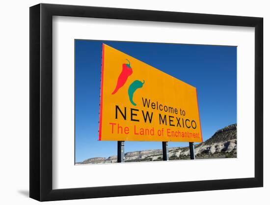 A Yellow Welcome to New Mexico Sign in Front of a Blue Sky-flippo-Framed Photographic Print