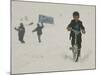 A Young Afghan Boy Rides His Bicycle on a Snow Covered Street-null-Mounted Photographic Print