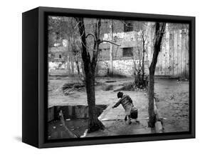 A Young Afghan Girl Carries Water from a Well to Her Family-null-Framed Stretched Canvas