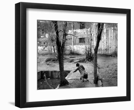 A Young Afghan Girl Carries Water from a Well to Her Family-null-Framed Photographic Print