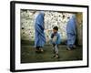 A Young Afghan Refugee Boy Stands in a Pair of Adult's Shoes-null-Framed Photographic Print