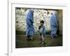 A Young Afghan Refugee Boy Stands in a Pair of Adult's Shoes-null-Framed Photographic Print