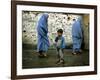 A Young Afghan Refugee Boy Stands in a Pair of Adult's Shoes-null-Framed Photographic Print