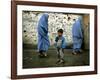 A Young Afghan Refugee Boy Stands in a Pair of Adult's Shoes-null-Framed Photographic Print