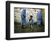 A Young Afghan Refugee Boy Stands in a Pair of Adult's Shoes-null-Framed Photographic Print